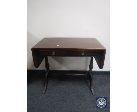 An inlaid mahogany sofa table fitted two drawers 