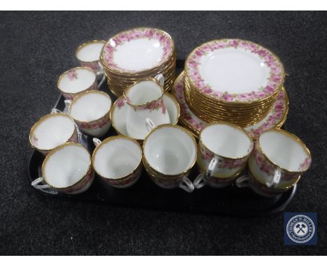 A tray containing a forty piece antique Royal Doulton china tea service decorated with pink roses