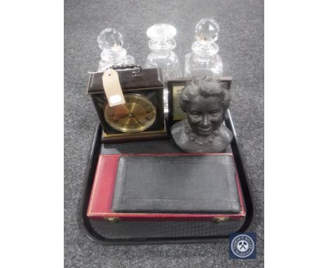 A tray containing three lead crystal decanters with stoppers, Metamec mantel clock, Heredities bust 'Queen Elizabeth, The Que