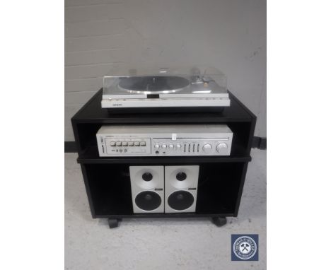 An Onkyo CP-1020F turntable together with an Onkyo cassette tuner amplifier, pair of Technics SB-F2 speakers and a magazine r