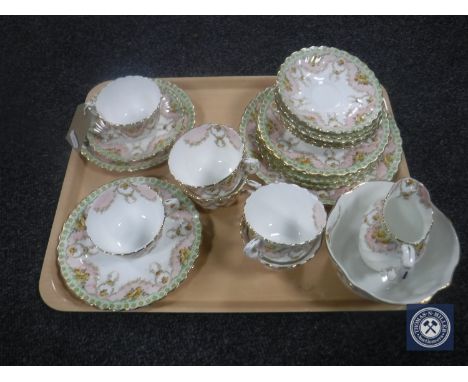A tray containing a twenty-one piece Victorian Staffordshire bone china tea service CONDITION REPORT: Comprising 6 teacups, 6