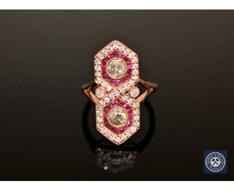 A 14ct rose gold ruby and diamond ring, with two brilliant-cut diamonds totalling 0.67 carat, of P2 clarity and I/J colour, f