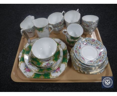 A tray containing eleven pieces of Grosvenor Windsor bone china together with a nineteen piece Windsor china tea service