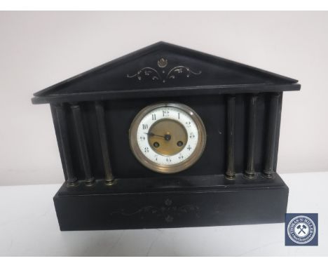 A Victorian black slate mantel clock