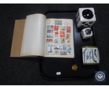 A tray containing 20th century Ace Herald stamp album together with a ceramic die ashtray and table lighter, trinket box and 