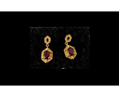 Ruby Geometric Drop Earrings, 2cts oval cut rubies, of a desirable rich red, set in elongated hexagon panels of 14ct gold ver