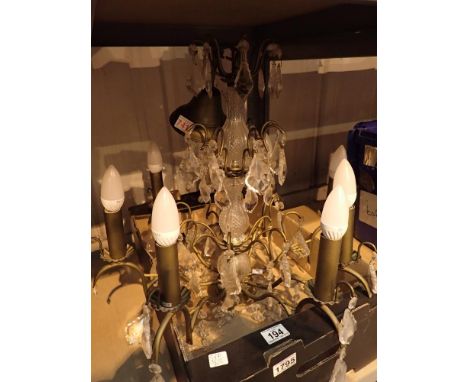 Three tier chandelier with brass finish and candle light mounts