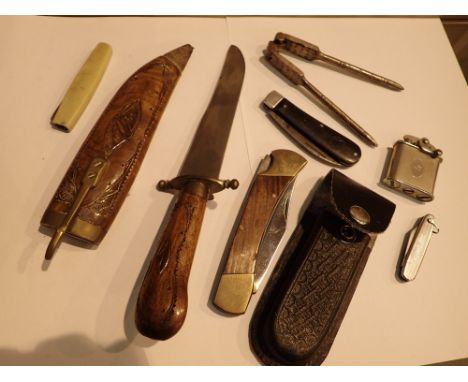 Collection of penknives nutcracker and Indian sheath knife and a lighter 