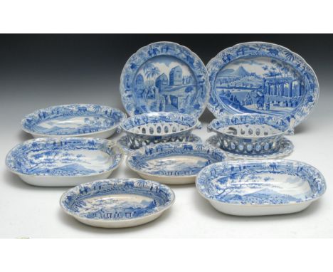 A pair of Spode blue and white pierced oval chestnut baskets on stands, printed with  Sarcophagi at Cacamo,  after the engrav