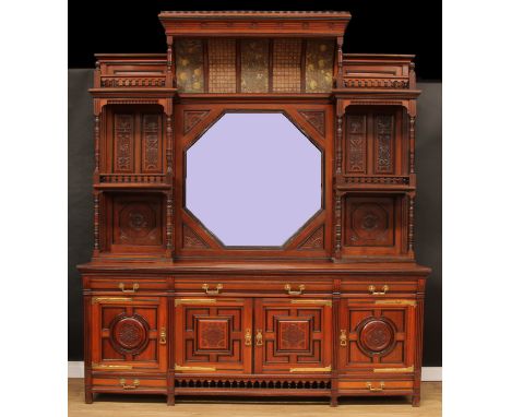 A substantial Aesthetic Movement drawing room side cabinet, of country house proportions, crenellated cornice above a concave