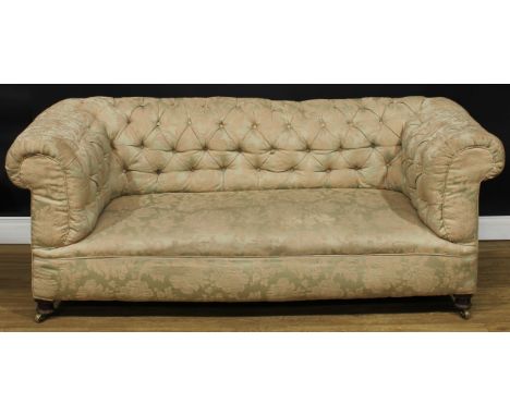 A Victorian Chesterfield sofa, scroll arms, stuffed-over upholstery, deep-button back, 75cm high, 185cm wide, the seat 125cm 