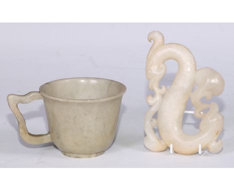 A Chinese soapstone wine cup, 6.5cm high; a Chinese hardstone carving, of an archaic dragon, 12cm wide (2) 