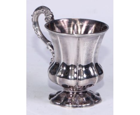 An Edwardian silver fluted campana christening cup, acanthus scroll handle, 10.5cm high, Walker &amp; Hall, Sheffield 1902, 1