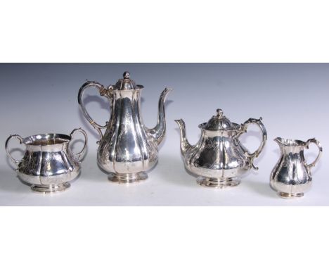 A Victorian silver four piece tea and coffee service, comprising teapot, coffee pot, milk jug and sugar basin, each engraved 