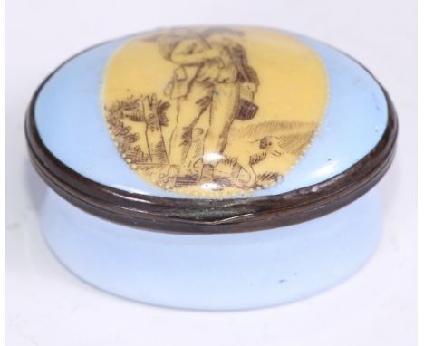 A George III South Staffordshire enamel oval patch box, hinged cover decorated in monochrome with an itinerant worker, within