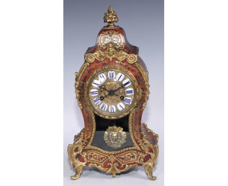 A 19th century French gilt metal mounted boulle cartouche shaped mantel clock, 8cm dial inscribed with Roman numerals upon en