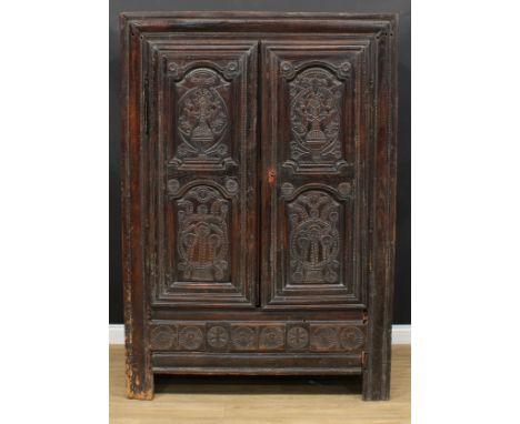 A late 17th century oak livery cupboard or housekeeper's cupboard, flush stiled frame centred by a pair of panel doors, the u