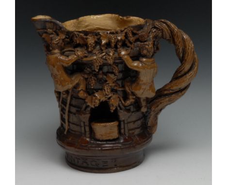 An Edward Bingham for Castle Hedingham pottery Essex jug, applied with figures collecting grapes,  twisted handle, inscribed 