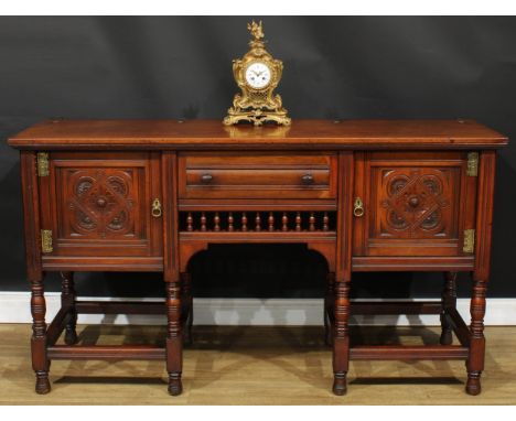 A late Victorian Aesthetic Movement walnut side cabinet, by Gillows of Lancaster and London, bearing label for Gillow &amp; C