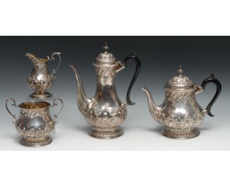 A Victorian silver four piece baluster tea and coffee service, comprising teapot, coffee pot, milk jug and sugar basin, embos