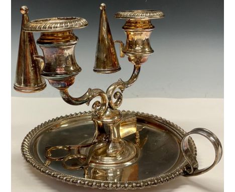 An unusual Regency Old Sheffield Plate two-light double chamberstick, campana sconces, gadrooned borders, conical snuffers, l