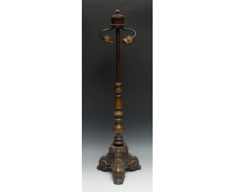 An early 20th century brass two-light side light, knopped column, triform scroll base, 52cm high 