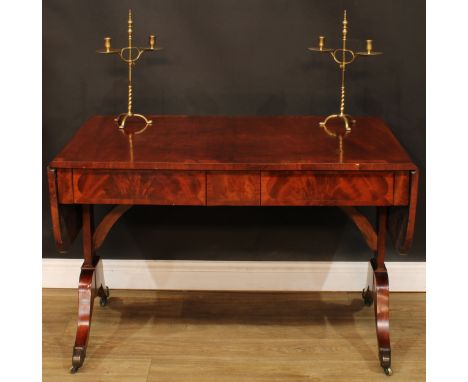 A Post-Regency mahogany sofa table, flame-banded rounded rectangular top with fall leaves, above a pair of frieze drawers, bl