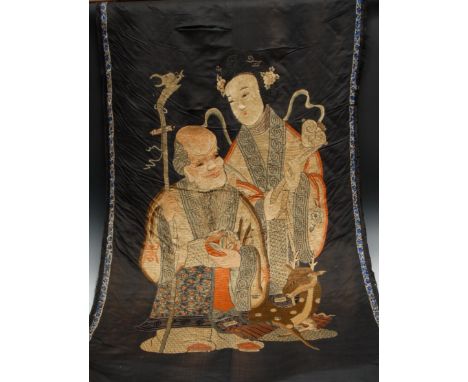A Chinese silk scroll banner, depicting Shou Lao and Guanyin, 74cm wide, early 20th century 
