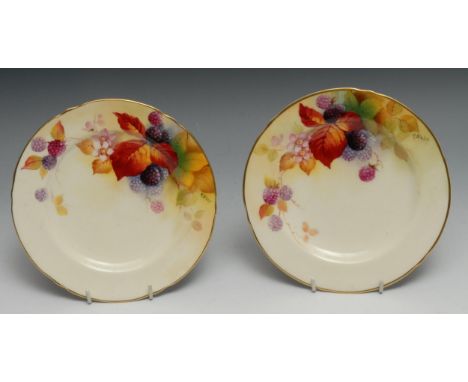 A pair of Royal Worcester side plates, painted by K. Blake, signed, with autumnal leaves and berries, 17.5cm diam, printed ma