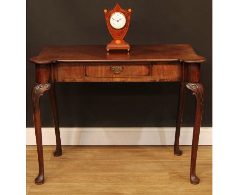 A George II mahogany side table, hipped rectangular top above a cockbeaded frieze drawer, cabriole legs, pad feet, formerly a