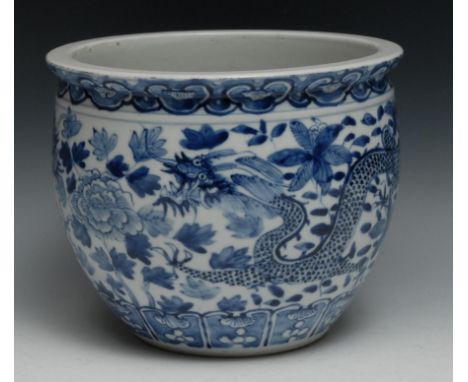 A Chinese blue and white jardinière, painted with dragons, 22.5cm diam,  Kangxi mark but later 