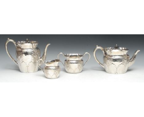 A late Victorian silver four piece tea and coffee service, comprising teapot, coffee pot, milk jug and sugar basin, each chas