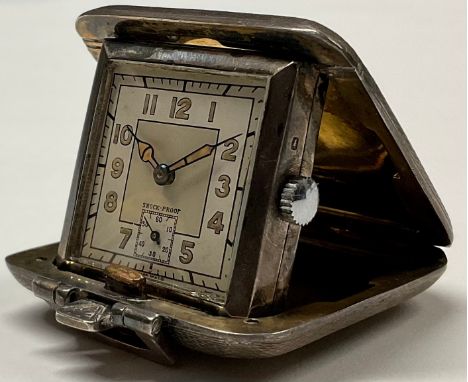 An Art Deco silver purse watch, engine turned, 4cm wide, Birmingham 1938 