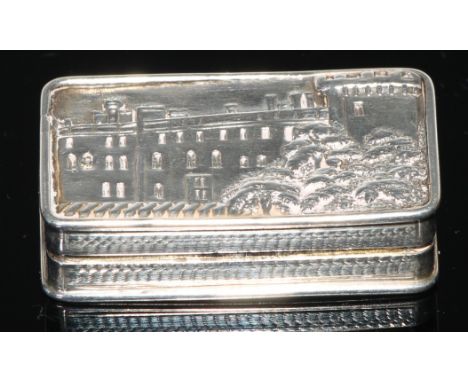 An early Victorian silver rounded rectangular castle top vinaigrette, hinged cover with a view of Warwick Castle, gilt interi