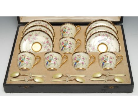 A Royal Worcester coffee service, for six, each printed and painted with fanciful birds perched on flowering branches, on a l