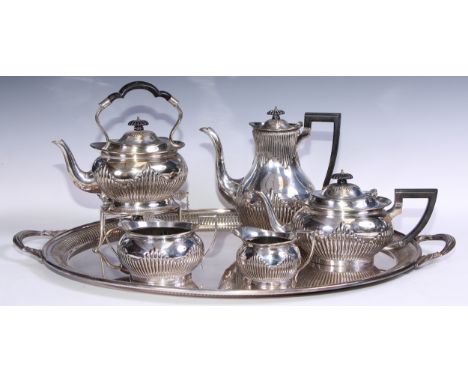 A six piece EPNS stop fluted tea service comprising tray, tea kettle and stand, coffee pot, tea pot, open sucrier and milk ju