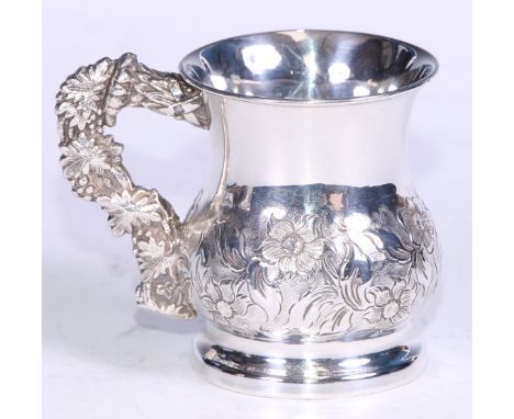 An unusual 19th century silver coloured metal bell shaped wine cup, possibly Colonial, chased with flowers and leaves, the ha