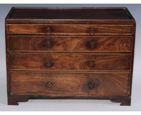 A 19th century mahogany tabletop caddy top chest, of four long graduated boxwood strung drawers, bracket feet, 30.5cm high, 4