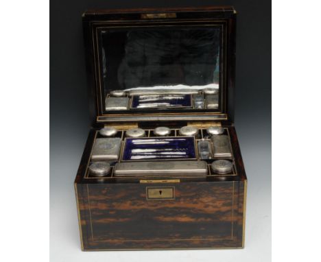 A Victorian coromandel rectangular dressing box, hinged cover enclosing dressing jars, scent bottle, mother-of-pearl hafted m