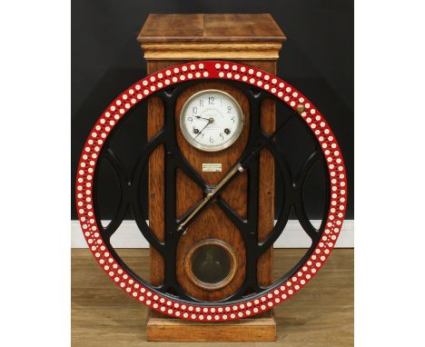 An early 20th century American oak 200 employee industrial dial recorder or clocking-in machine, marketed by Howard Brothers,