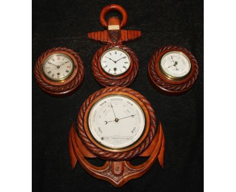 A late Victorian/Edwardian wall hanging combination aneroid barometer and timepiece, of maritime interest as an anchor, rope 