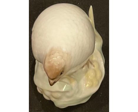 A Royal Worcester 'netsuke', modelled as a white quail, crown and circle mark in green, 5cm high, dated code for 1913 
