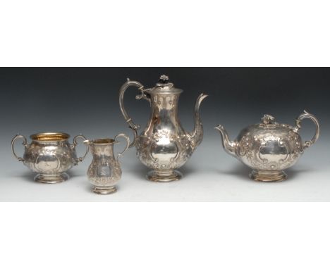 A Victorian Irish silver four piece tea and coffee service, comprising teapot, coffee pot, milk jug and sugar basin, chased i