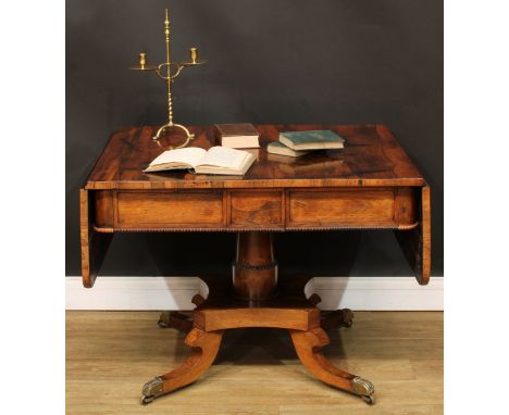 A Regency rosewood sofa table, rounded rectangular top with fall leaves above a pair of frieze drawers, blind to verso, the a