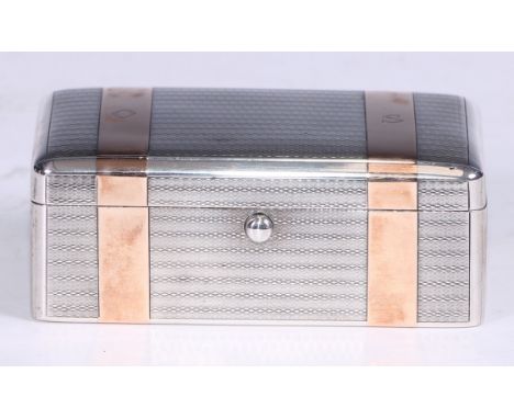 A George V gold inlaid silver rounded rectangular shaving box, hinged cover enclosing a razor and strops, engine turned, 10cm