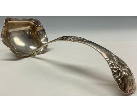 A Dutch silver ladle, chased with flowers, stiff leaves and scrolls, 31cm long, 164g 