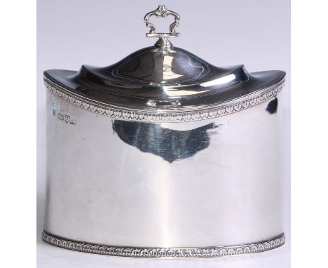 An Edwardian silver oval tea caddy, of plain George III design, acanthus borders, hinged cover, gilt interior, 15.5cm wide, N