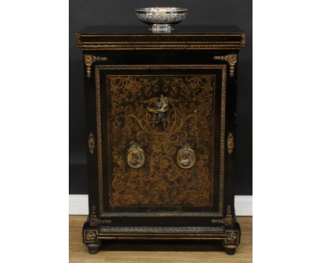 A 19th century French ormolu mounted boulle and ebonised pier cabinet, oversailing top above a rectangular door applied with 