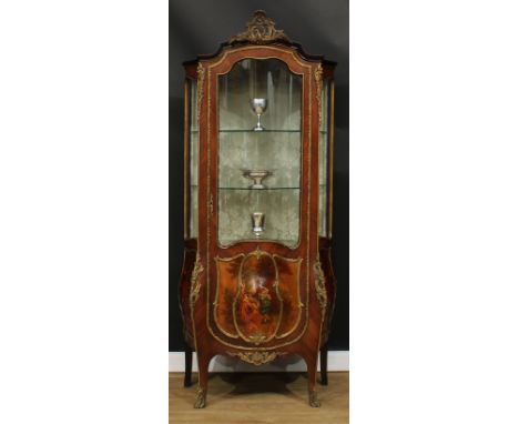 A Louis XV Revival gilt metal mounted serpentine Vernis Martin vitrine, shaped pediment cast with scrolling acanthus, above a