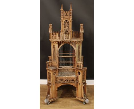 A Gothic Revival design architectural floor standing aviary or birdhouse, pierced, carved and applied throughout with tracery